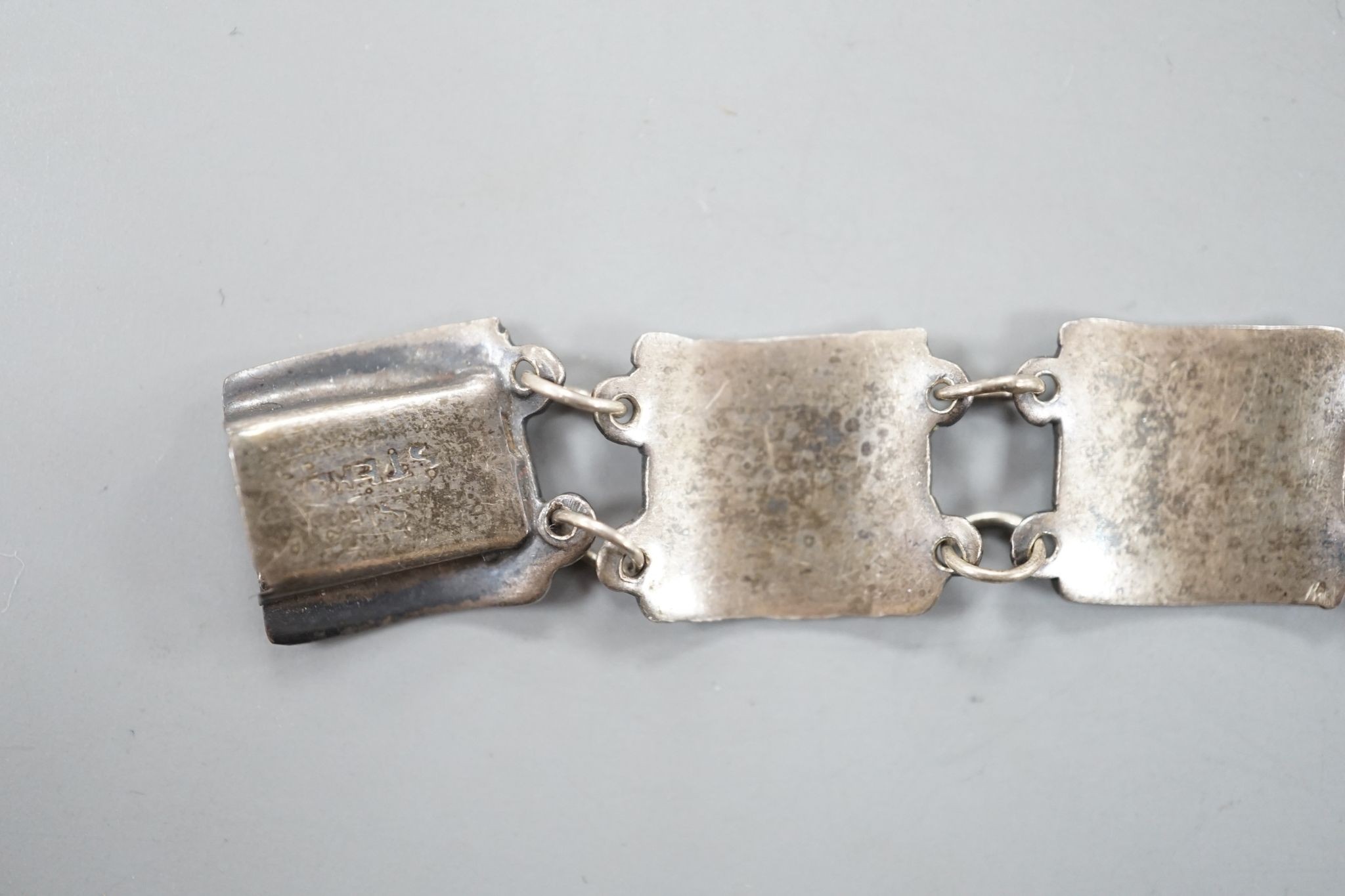 Three silver pill boxes, a key ring and white metal and niello bracelet.